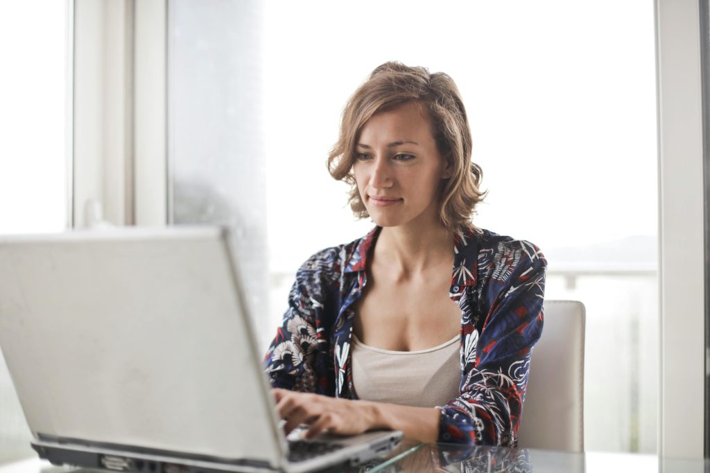 Photo by Andrea Piacquadio: https://www.pexels.com/photo/woman-in-blue-floral-top-sitting-while-using-laptop-806835/